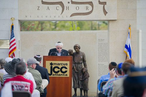 Abe Besser, one of the many Holocaust survivors living in the metro area, speaks during the Yom HaShoah commemoration ceremony at the Marcus Jewish Community Center of Atlanta in Dunwoody on Sunday, April 7, 2013.