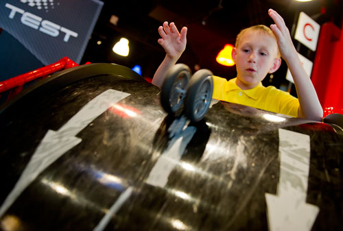Lance Witt tests his LEGO racecar at the LEGOLAND Discovery Center at Phipps Plaza in Buckhead on Monday, April 8, 2013.