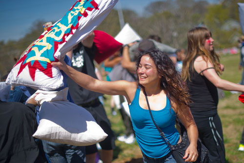 Shannon Byrne (center) battles it out with a kablam pillow during the pillow fight at Freedom Park in Little Five Points on Saturday, April 6, 2013. 