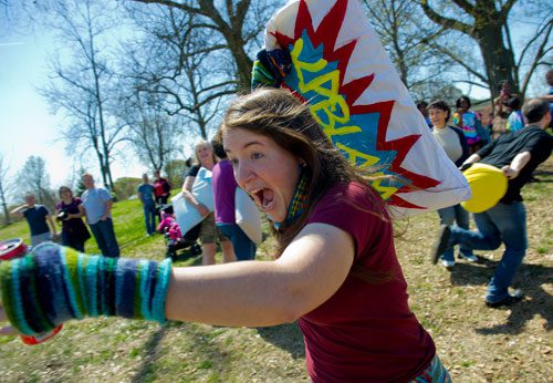 Elena Simon yells as she charges into the fray with her pillow during the pillow fight at Freedom Park in Little Five Points on Saturday, April 6, 2013. 