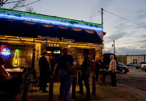 Muscians and blues fans stand outside of the Northside Tavern in Atlanta during a tribute for the late Robert "Chicago Bob" Nelson on Saturday, April 6, 2013.