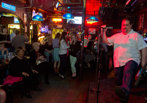Carlos Capote (right), lead singer for the Breeze Kings, performs on stage at the Northside Tavern in Atlanta during a tribute for the late Robert "Chicago Bob" Nelson on Saturday, April 6, 2013.
