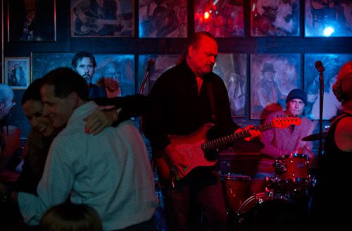 Tinsley Ellis (center) performs with the Breeze Kings on stage at the Northside Tavern in Atlanta as Sissy Hines dances with Tim Bendin on Saturday, April 6, 2013. 