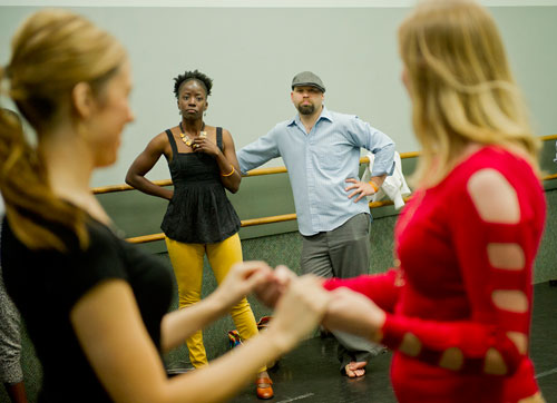 War Coryelll (left) and her husband Jonathan watch as Chrystal Hare learns a move with All About Ballroom instructor Kathy Casper during a salsa class in Alpharetta on Saturday, April 13, 2013.