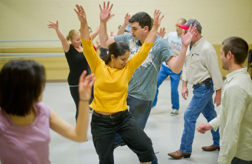 Suji Rao (center left) and Joel DeSalvo (center right) practice a new dance step during a Dance 4 Fun swing class in Lawrenceville on Monday, April 15, 2013. 
