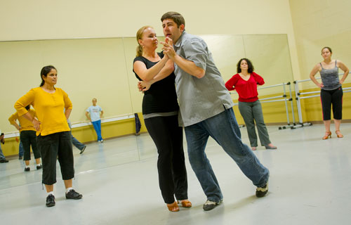 Mirka Roach (center left) and Dance 4 Fun instructor Matthew Johnson (center right) demonstrate a new dance step as Suji Rao (left), Marise Teixeira and Marie Collantes watch during a swing class in Lawrenceville on Monday, April 15, 2013.