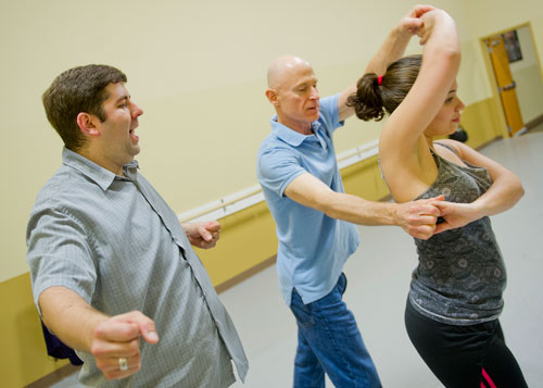 Dance 4 Fun instructor Matthew Johnson (left) gives some pointers to Jon Cohen and Marie Collantes as they practice a new dance step during a swing class in Lawrenceville on Monday, April 15, 2013. 