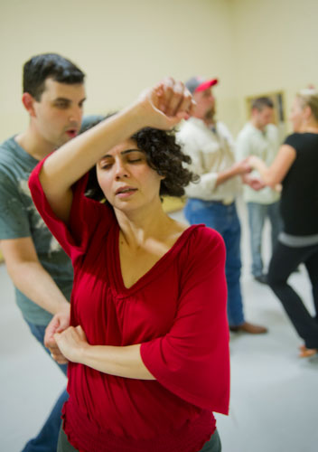 Marise Teixeira (front) is spun by Joel DeSalvo as they practice a new dance step during a Dance 4 Fun swing class in Lawrenceville on Monday, April 15, 2013. 