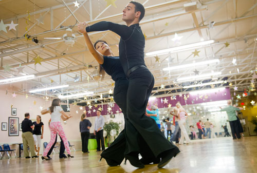 Jessie Lin (left) and Luca Guidoni move around the dance floor during a private lesson at Atlanta Ballroom Dance Centre in Sandy Springs on Wednesday, April 17, 2013.