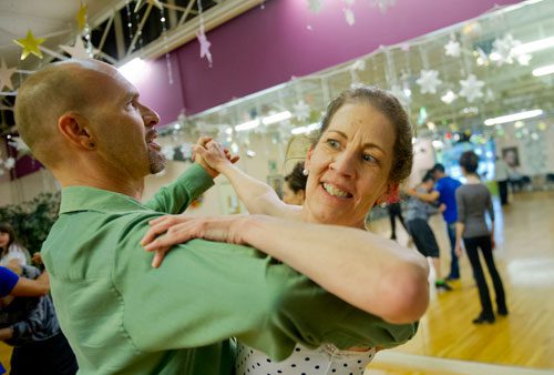 Instructor Rainier Rics (left) leads Kitty Canupp around the dance floor during a private lesson at Atlanta Ballroom Dance Centre in Sandy Springs on Wednesday, April 17, 2013.