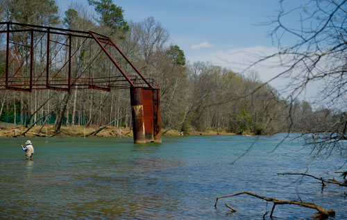 A fisherman casts his rod into the Chattahoochee River at Jones Bridge Park in Peachtree Corners on Saturday, March 30, 2013.