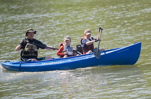 Paul McClung (left) and his two sons Holden and Caleb paddle down the Chattahoochee River in a canoe in Roswell on Saturday, June 15, 2013. 