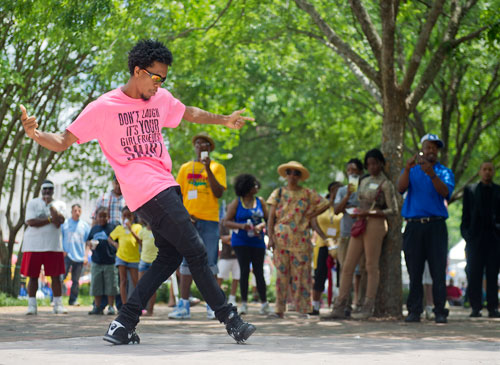 James D. Love (left), half of the performance duo Kinetix, performs during the Cobb NAACP Juneteenth Celebration in Marietta Square on Saturday, June 15, 2013.