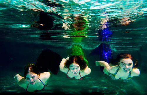 For the past four years Olivia Plump (left), her sister Hannah and Claire Rohrbach have been performing for special events and birthday parties dressed as mermaids.