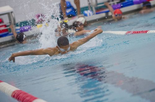 Donovan Johnson comes up for a breath as he swims a lap of butterfly during practice for the City of Atlanta Dolphins at Adamsville Natatorium on Tuesday, May 28, 2013. 