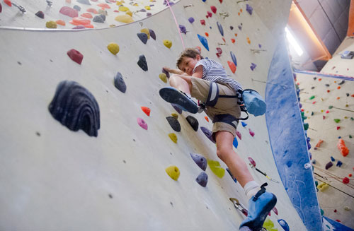 Alex Singer makes his way up a rock wall during climbing camp at the Stone Summit Climbing Center in Atlanta on Thursday, June 6, 2013. 