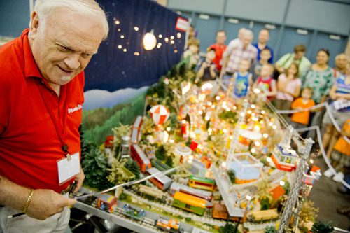 Brian McWilliams runs the Squeekville train display during the 23rd Annual Nation Train Show at the Cobb Galleria Centre in Atlanta on Saturday, July 20, 2013. 
