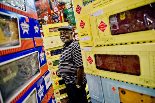 Wesley Cooper looks at different G scale train cars for sale during the 23rd Annual Nation Train Show at the Cobb Galleria Centre in Atlanta on Saturday, July 20, 2013. 