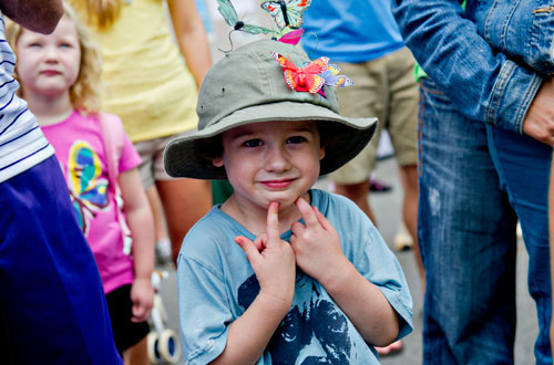 Luke Williams stands in the crowd with hundreds as they wait for the first butterfly release of the day during the 14th annual Flying Colors Butterfly Festival at the Chattahoochee Nature Center in Roswell on Saturday, July 13, 2013.