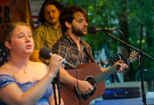 Members of the band Waller, Jason Waller (center), Tiffany Blalock (left) and Zac Caplan perform on stage at Matilda's Under the Pines in Alpharetta on Saturday, July 13, 2013.