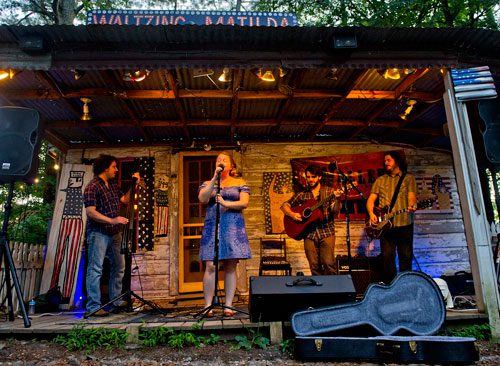 Billy Lyons (left), Tiffany Blalock, Jason Waller and Zac Caplan of the band Waller perform on stage at Matilda's Under the Pines in Alpharetta on Saturday, July 13, 2013. 