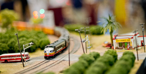 An HO scale model train runs down the tracks of the Gulf Western Modular Railroad Society's display during the 23rd Annual National Train Show at the Cobb Galleria Centre in Atlanta on Saturday, July 20, 2013.