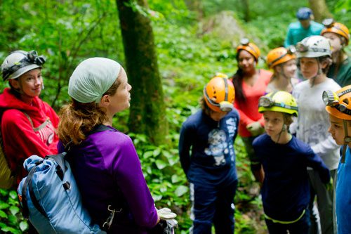 Georgia Girl Guides Christine Rose (center) and Amy Ward give instructions to a group of campers from Decatur-based Camp Scene Environmental Adventures before heading into Sitton's Cave at Cloudland Canyon State Park in Rising Fawn, Georgia on Tuesday, June 18, 2013.
