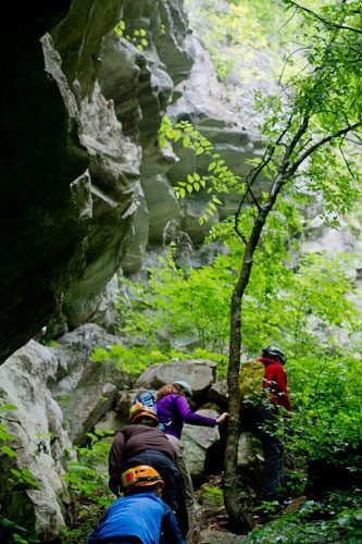 Amy Ward (right), Christine Rose, John Caudill and Tucker Bush climb a trail leading to the main entrance to Sitton's Cave in Cloudland Canyon State Park in Rising Fawn, Georgia on Tuesday, June 18, 2013.