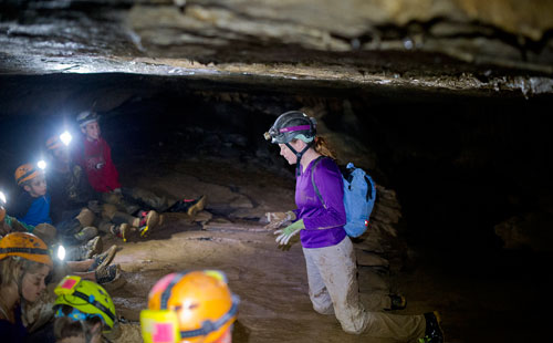 Georgia Girl Guide Christine Rose (right) explains different formations to campers as they explore a section of Sitton's Cave in Cloudland Canyon State Park in Rising Fawn, Georgia as part of Decatur-based Camp Scene Environmental Adventures' summer camp on Tuesday, June 18, 2013. 
