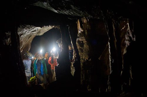 George Dusenbury (left) and Tucker Bush (center) explore a section of Sitton's Cave in Cloudland Canyon State Park in Rising Fawn, Georgia as part of Decatur-based Camp Scene Environmental Adventures' summer camp on Tuesday, June 18, 2013. 
