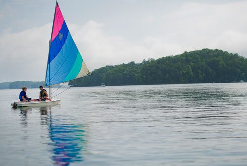 Jake Sibbit (left) and Max White sail their sunfish sailboat across Lake Lanier during Lord Nelson Charters' Summer Sailing Camp in Buford on Tuesday, July 9, 2013. 