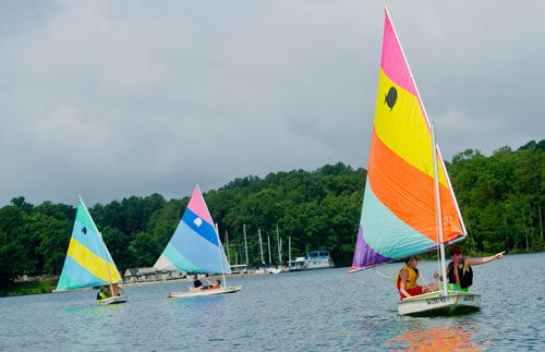 Chase Hart (right) and Parks Barnard sail their sunfish sailboat across Lake Lanier during Lord Nelson Charters' Summer Sailing Camp in Buford on Tuesday, July 9, 2013. 