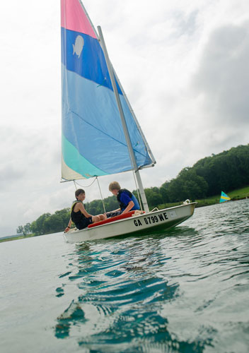 Max White (left) and Jake Sibbit sail their sunfish sailboat across Lake Lanier during Lord Nelson Charters' Summer Sailing Camp in Buford on Tuesday, July 9, 2013. 