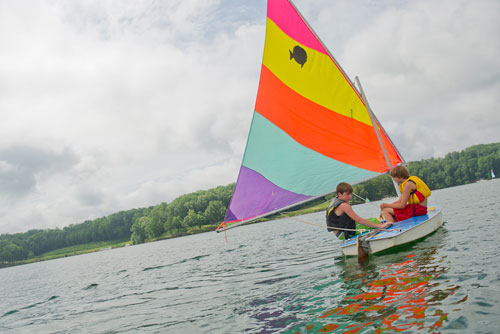Chase Hart (left) and Parks Barnard sail their sunfish sailboat across Lake Lanier during Lord Nelson Charters' Summer Sailing Camp in Buford on Tuesday, July 9, 2013. 