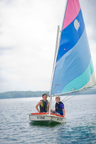 Max White (left) and Jake Sibbit sail their sunfish sailboat across Lake Lanier during Lord Nelson Charters' Summer Sailing Camp in Buford on Tuesday, July 9, 2013. 