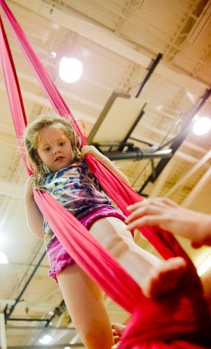 Flynn Peljovich uses silks during Circus Summer Camp at Davis Academy in Dunwoody on Wednesday, July 10, 2013. 
