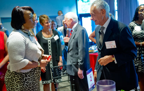 Rev. Bernice King (left) speaks with  Rev. C.T. Vivian during America's Sunday Supper at the Carter Center in Atlanta on Sunday, August 11, 2013. 