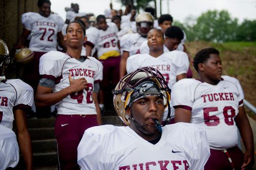 Tucker's Ramel Crawford (center) waits to take the field with his teammates before their game against Cedar Grove at Panthersville Stadium in Decatur on Friday, August 23, 2013.  