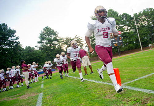 Tucker's Detrick Dukes (9) warms up with his teammates before their game against Cedar Grove at Panthersville Stadium in Decatur on Friday, August 23, 2013. 