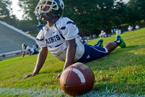 Cedar Grove's Anthony Lattmore stretches before their game against Columbia at Panthersville Stadium in Decatur on Friday, August 30, 2013.