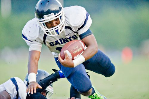 Cedar Grove's Deion Sellers (16) dives forward with the ball during their game against Columbia at Panthersville Stadium in Decatur on Friday, August 30, 2013.