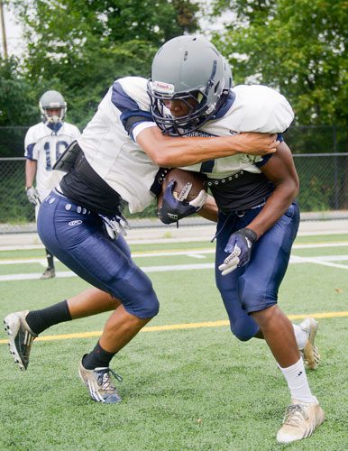 Norcross' Ridwan Issahaku (right) collides with Jordan Noio during practice on Wednesday, August 21, 2013.