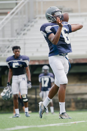 Norcross' A.J. Bush (right) runs a play during practice on Wednesday, August 21, 2013. 