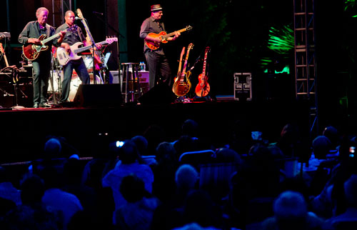 Boz Scaggs (left) performs on stage with bassist Richard Patterson and guitarist Drew Zingg during the Wells Fargo Concerts in the Garden Series at the Atlanta Botanical Gardens on Friday, July 19, 2013. 