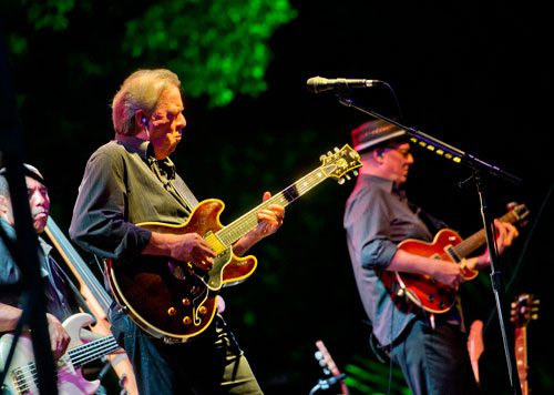 Boz Scaggs (center) performs on stage with bassist Richard Patterson and guitarist Drew Zingg (right) during the Wells Fargo Concerts in the Garden Series at the Atlanta Botanical Gardens on Friday, July 19, 2013.