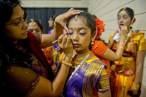 Srikanthi Vantipalli (left) helps Riya Chada with her makeup during the 17th annual Festival of India at the Gwinnett Center in Duluth on Saturday, August 24, 2013.