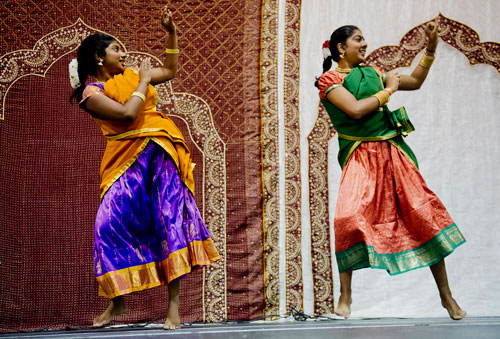 Veena Jaipradeep (left) and Anisha Jayachandran dance during the 17th annual Festival of India at the Gwinnett Center in Duluth on Saturday, August 24, 2013. 