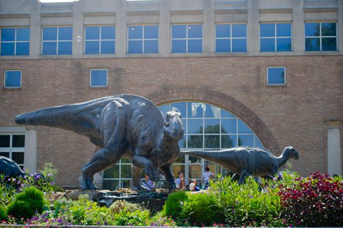 Dinosaurs greet visitors to the Fernbank Museum of Natural History in Atlanta on Saturday, August 24, 2013.