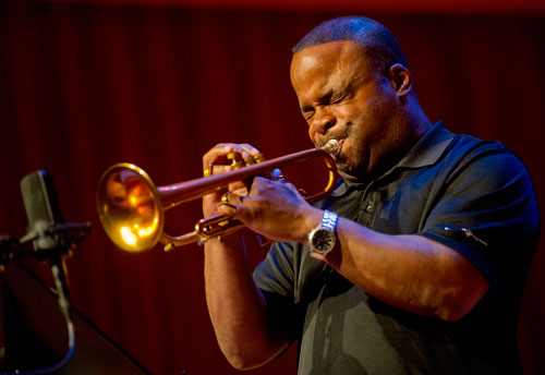 Lester Walker plays a trumpet solo as he performs as part of the Kennesaw State University Faculty Jazz Parliament on stage at the Bailey Performance Center on campus during the Starlight Summer Concert Series on Sunday, July 21, 2013. 