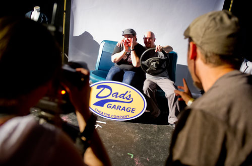 Rebecca Strickland (center left) and her husband Jonathan have their photo taken by Elizabeth Davidovich and Nate Dorn during the Bringing Down the House Party at Dad's Garage in Atlanta on Saturday, August 3, 2013.